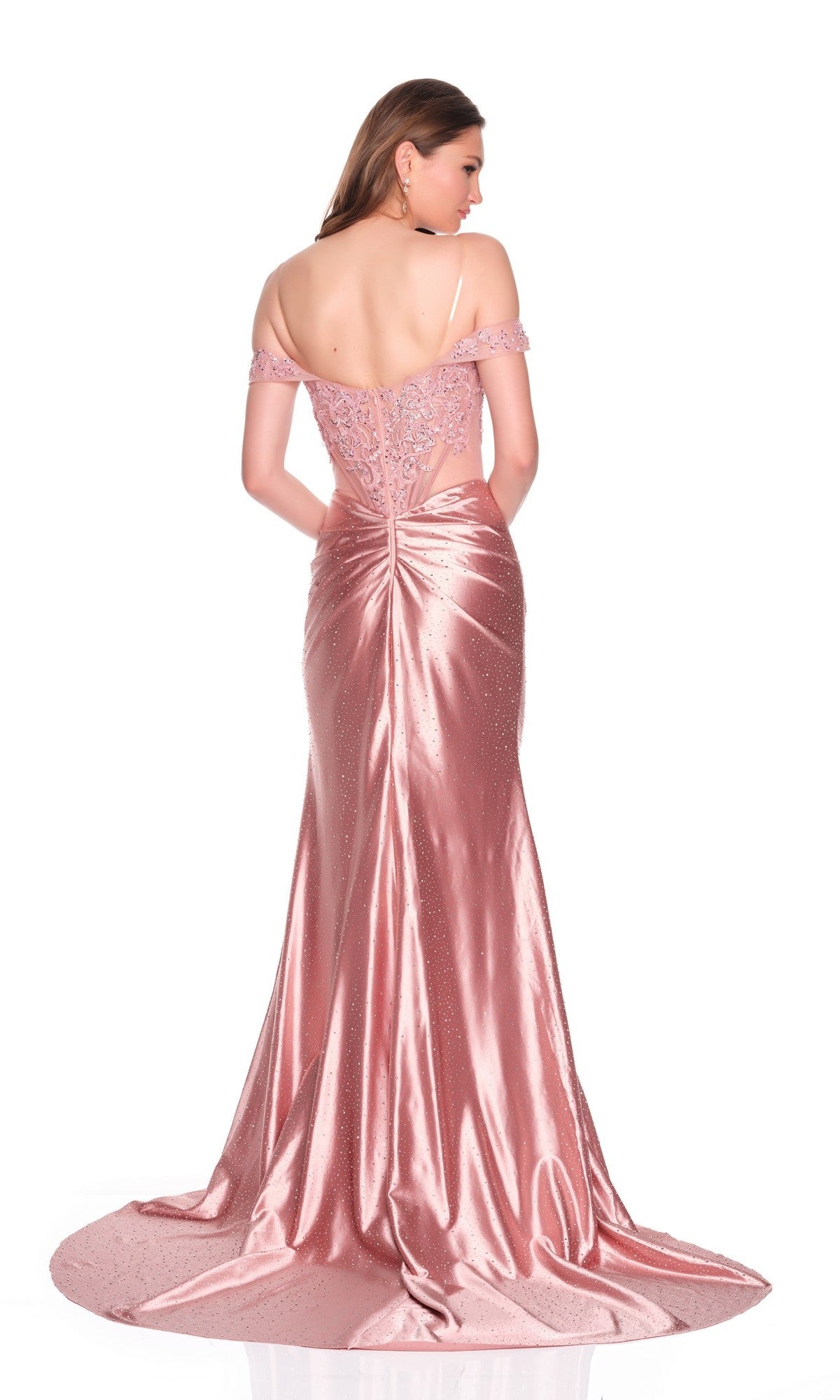A woman, facing away from the camera against a white background, wears the Dave and Johnny 12761 Long Prom Dress—floor-length, pink satin with an off-the-shoulder lace back and train.